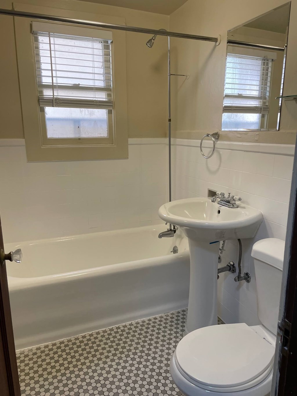 a bathroom with a sink toilet and a bath tub